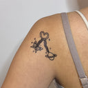 Butterfly with Saturn Key Charm